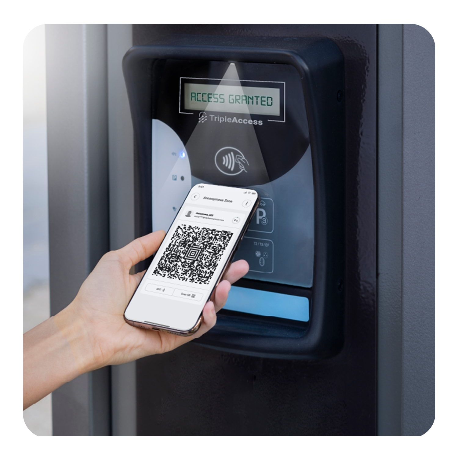 Hand holding phone to access control device